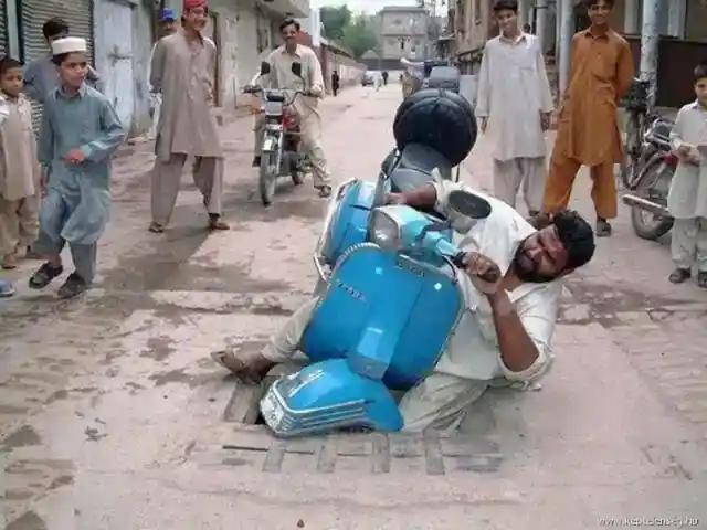 Indian man crashes Vespa