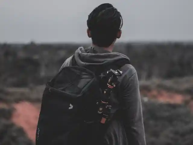 Putting Something In His Backpack