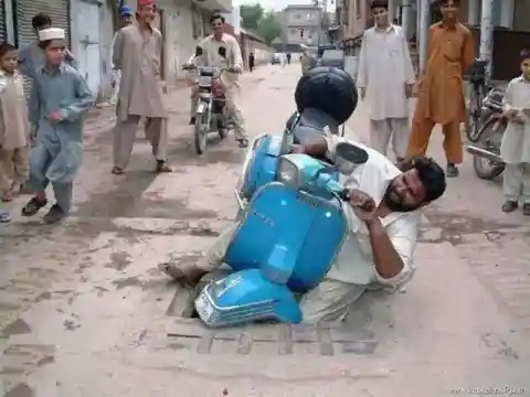 Indian man crashes Vespa