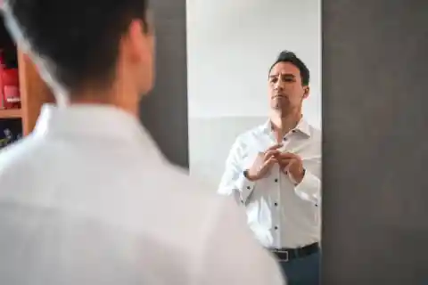 Adjusting His Tie 